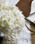 Lifelike white hydrangea arrangement in antique vase, artificial flowers for timeless home decor by sostter at brixbailey.com