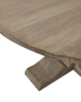 Round pedestal dining table with bleached hardwood top, black iron accents, and French-inspired design for elegant gatherings. by Sostter at brixbailey.com