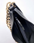 Black Leather Handbag with Metallic Straps