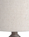 Rustic table lamp with whitewashed wood base and linen shade, warm beige tones for cozy ambient lighting. by Sostter at brixbailey.com
