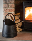 Handcrafted black steel coal bucket with wooden shovel, rustic vintage decor for farmhouse or industrial interiors. by sostter at brixbailey.com