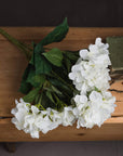 Creamy off-white artificial hydrangea bouquet with ultra-realistic petals, perfect for timeless home decor. by sostter at brixbailey.com