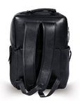 Premium black leather backpack for travel, handcrafted from recycled full-grain cowhide, eco-friendly with antique brass hardware, spacious laptop compartment, durable and stylish by Bethikal at brixbailey.com