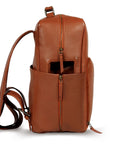 Premium tan leather backpack for travel and adventure, sustainable recycled materials, handcrafted full-grain Nappa leather, antique brass hardware, spacious laptop compartment, durable slow-fashion design by Bethikal at brixbailey.com