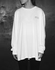 Luxury oversized white long sleeve tee with handprinted WWOOLLFF CO. graphics, premium organic cotton, stylish unisex design by WWOOLLFF CO. at brixbailey.com