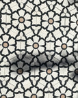 Luxury black cement floor tile with elegant white floral pattern, premium hexagon kitchen and bathroom tiles, best-selling UK delivery by Maria Starling Design at brixbailey.com
