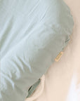premium baby lounger, portable infant nest, soft and snug newborn lounger, best-selling tencel baby nest, stylish organic cotton baby lounger by Faemli at brixbailey.com