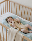 premium baby lounger, portable infant nest, soft snug newborn rest station, best-selling tencel fiber lounger, stylish lightweight baby bed by Faemli at brixbailey.com
