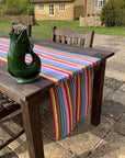 Luxury rainbow table runner, 100% cotton recycled organic yarn, handcrafted in England, stylish 2.5m long, best-selling party decor by Maison Elhoria at brixbailey.com