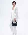 Luxury Marshmallow Croissant Bag, premium black leather evening handbag, stylish foldable clutch, trending statement piece by Bob Oré at brixbailey.com