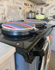 Luxury rainbow chef pad for Aga range cooker, handmade heat-retaining hob cover, premium recycled cotton, stylish UK woven fabric by Maison Elhoria at brixbailey.com