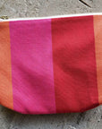 Premium British-made red orange pink toiletry bag, stylish waterproof zip organizer with herringbone stripes, 8 inches compact by Maison Elhoria at brixbailey.com