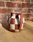 Checkered ceramic pitcher