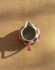 Checkered ceramic pitcher