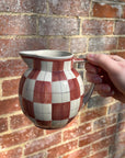Checkered ceramic pitcher