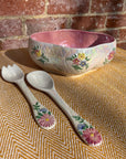 Floral salad bowl, with serving utensils