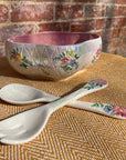 Floral salad bowl, with serving utensils