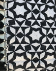 Luxury monochrome flat weave wool rug, handmade in India, stylish geometric design with tassels, best-selling contemporary ethnic decor by Maria Starling Design at brixbailey.com