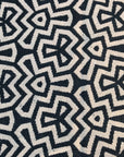Luxury flat weave rug, monochrome geometric design, handmade wool rug, stylish contemporary ethnic decor, premium tassel edge, best-selling by Maria Starling Design at brixbailey.com