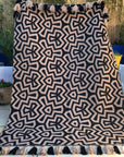 Luxury monochrome flat weave wool rug, handmade in India, stylish geometric design with tassels, best-selling neutral tones by Maria Starling Design at brixbailey.com