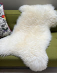 Luxury large British white sheepskin rug, eco-tanned sustainable premium throw, best-selling plush cream fleece for home decor by Wildash London at brixbailey.com
