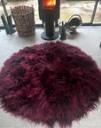 Luxury Icelandic sheepskin round rug, premium handcrafted Bordeaux red, stylish 140cm diameter, best-selling for boudoir or library by Wildash London at brixbailey.com