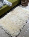 Luxury British white curly sheepskin rug, premium natural ivory fur, soft plush 90cm x 150cm, hypoallergenic sustainable free-range by Wildash London at brixbailey.com