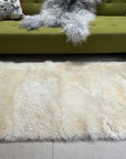 Luxury British white curly sheepskin rug, premium natural wool, soft plush fur, 90cm x 150cm, hypoallergenic, sustainable free-range sheep by Wildash London at brixbailey.com