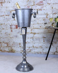 Luxury vintage floor standing champagne ice bucket, distressed silver aluminium, elegant champagne cooler for bars, restaurants, upscale events by Maravi at brixbailey.com