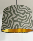 Green wiggle drum lampshade/ ceiling shade, with a metallic brushed gold lining