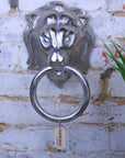 Shere metal lion head wall ornament, premium cast aluminum decorative piece, majestic regal lion design, stylish home decor statement by Maravi at brixbailey.com