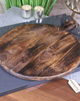 Amba rustic round wooden serving board, premium mango wood, stylish charcuterie cheese platter, handcrafted kitchen dining accessory by Maravi at brixbailey.com
