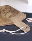 Luxury handcrafted fish serving platter board, premium mango wood with intricate lobster or fish engraving, stylish coastal kitchenware by Maravi at brixbailey.com