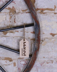 Sawali rustic wheel hanging ornament, industrial decor, premium metal wall art, weathered rustic charm, stylish focal point for living room or hallway by Maravi at brixbailey.com