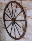 Sawali rustic wheel hanging ornament, industrial decor, weathered metal wall art, vintage rustic charm, premium focal point by Maravi at brixbailey.com