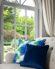 Luxurious Leaves velvet cushion, premium blue and green leaf design, elegant midnight blue backing, stylish home decor, plush microfiber insert by Isla Lawrie at brixbailey.com