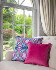 Luxury Botanical Bliss Velvet Cushion, bold hot pink floral design with green-blue accents, vibrant fuchsia backing, premium microfibre pad by Isla Lawrie at brixbailey.com