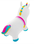 a toddler laughing while bouncing on a magical unicorn hopper toy in a sunny garden