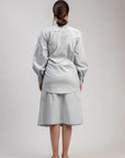 Luxury oversized ice blue shirt with tie-up detailing, upcycled cotton linen, stylish and comfortable, best-selling Kate Blue shirt by Bethikal at brixbailey.com