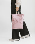 Chic Pink Denim Backpack with Bow – Stylish & Practical by Muni at www.brixbailey.com