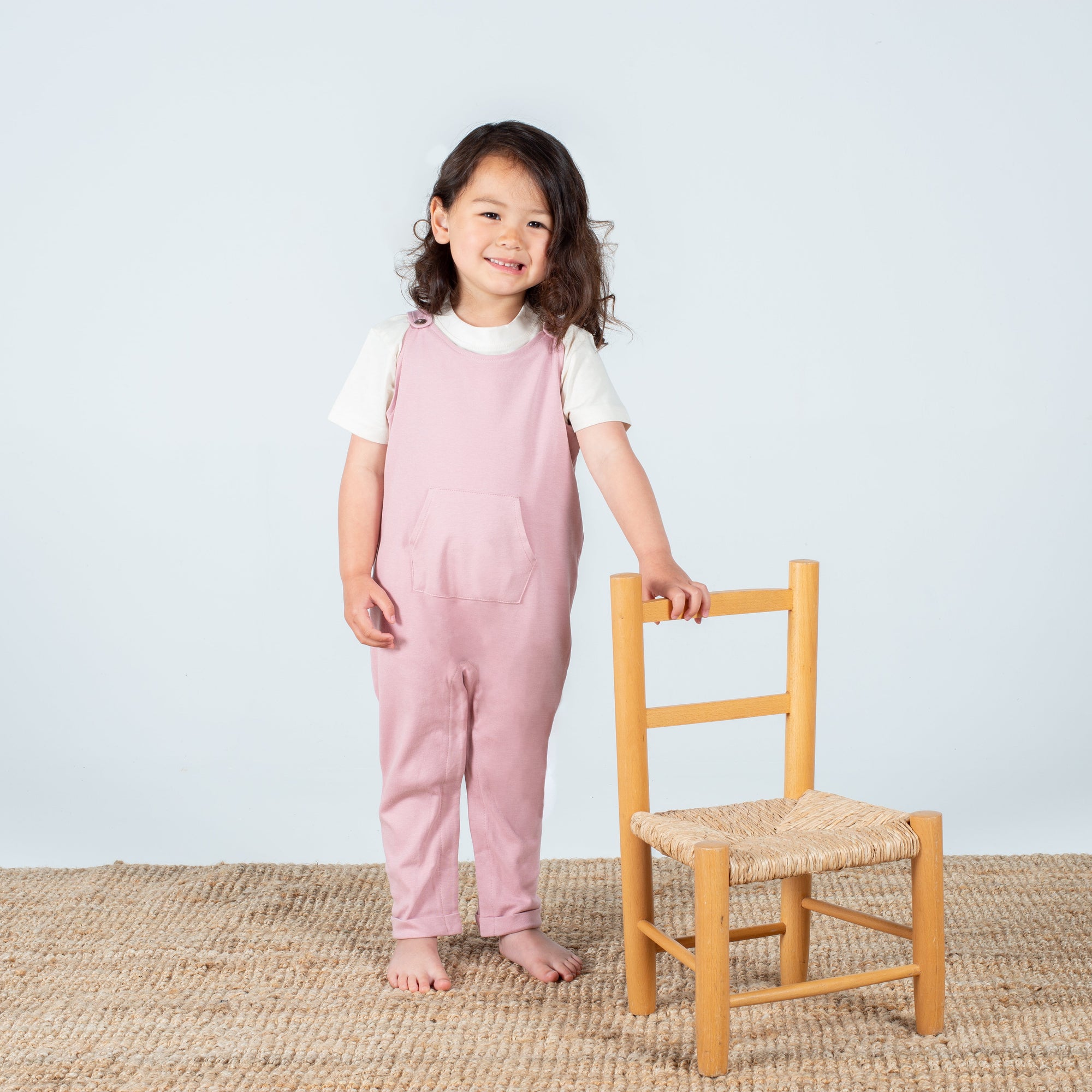 Soft Pink Organic Cotton Dungarees with Floral Appliqué, Horn-Button Fastening, and Kangaroo Pocket by Flossie & George at brixbailey.com