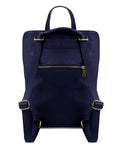 a playful navy leather backpack on a sunny park bench, ready for a spontaneous adventure