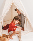 XL Kids' Teepee by Minicamp - Natural Canvas Play Tent with Pom Pom Decor by Minicamp at brixbailey.com