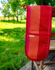 Premium double oven glove in red, orange, pink striped design, luxury handcrafted heat protection by Maison Elhoria at brixbailey.com
