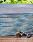 Premium Beach House Blue toiletry bag, luxury handwoven cotton travel organizer with water-resistant lining, large 14-inch metal zip by Maison Elhoria at brixbailey.com