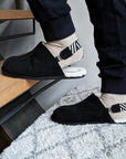 Premium mens luxury slippers, black shearling lined slingback with detachable strap, soft sheepskin upper, lightweight EVA sole, slip-resistant, durable by MANTIDY at brixbailey.com
