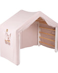 Large White Ladder House With a Pink Cover