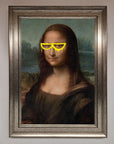 Premium Mona Lisa Glasses Framed Print, stylish modern twist on classic art, luxury home decor, trending wall art, best-selling unique masterpiece by Zestio at brixbailey.com