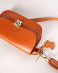 Classic Cut Leather Saddle Bag – Timeless Elegance by Zelma Kraft by Zelma Kraft at brixbailey.com