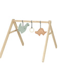 Premium baby gym with dino toys, organic cotton sensory play arch for newborns to 18 months, handcrafted beechwood structure, trending Montessori activity gym by Ella James at brixbailey.com